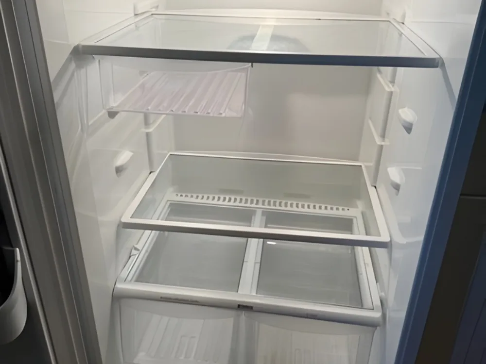 Refrigerator deep cleaning showing progress during washing process.