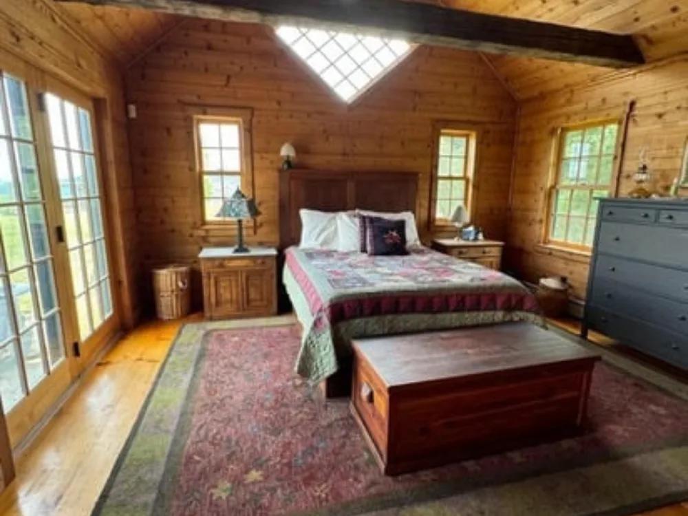 Spotless bedroom after Airbnb cleaning, featuring a made bed and clean surfaces.
