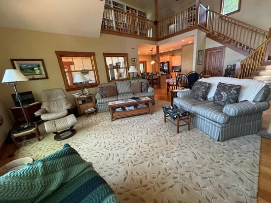 The dining area and kitchen, with all surfaces wiped clean after lakefront home deep cleaning.